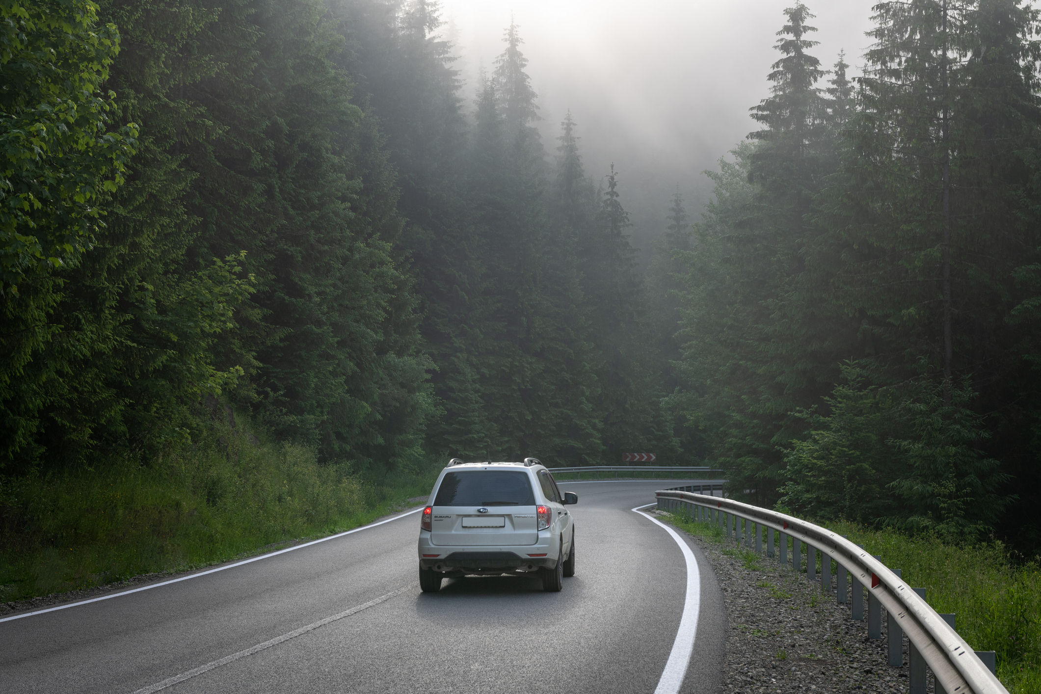 Subaru on mountain road